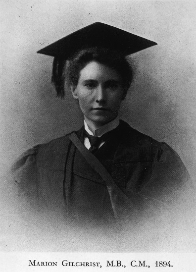 Portrait of a woman with a graduate hat and gown.